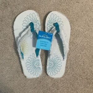 New - White with blue and gold flowers flip flops Size 7-8.